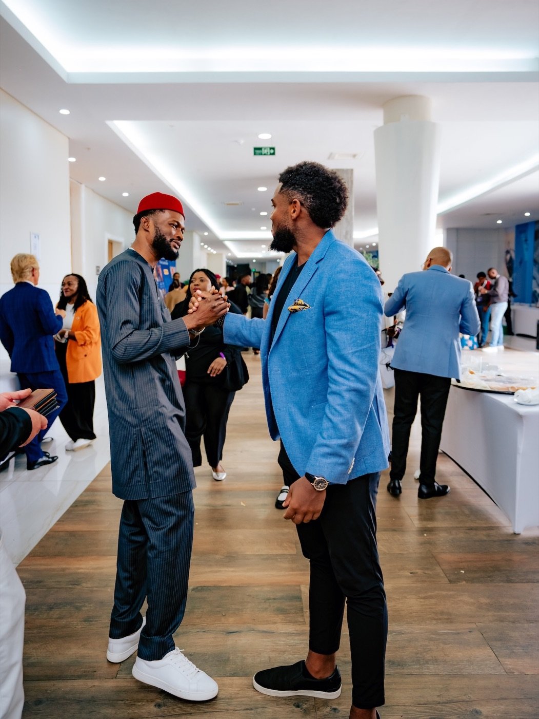 Two African professionals greeting one another during an Elevate Africa gathering